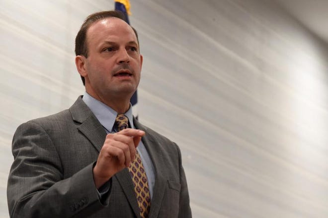 FILE - In this April 30, 2021 file photo, South Carolina Attorney General Alan Wilson speaks to attendees at the Richland County GOP convention in Columbia, S.C. The University of South Carolina can't lawfully require students and staff to wear face coverings on campus this fall, despite increasing cases of coronavirus, thanks to recent legislative action, according to the state's top prosecutor. (AP Photo/Meg Kinnard)