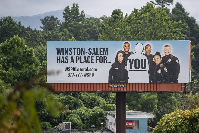 A billboard advertising the Winston-Salem Police Department, located on Patton Ave.