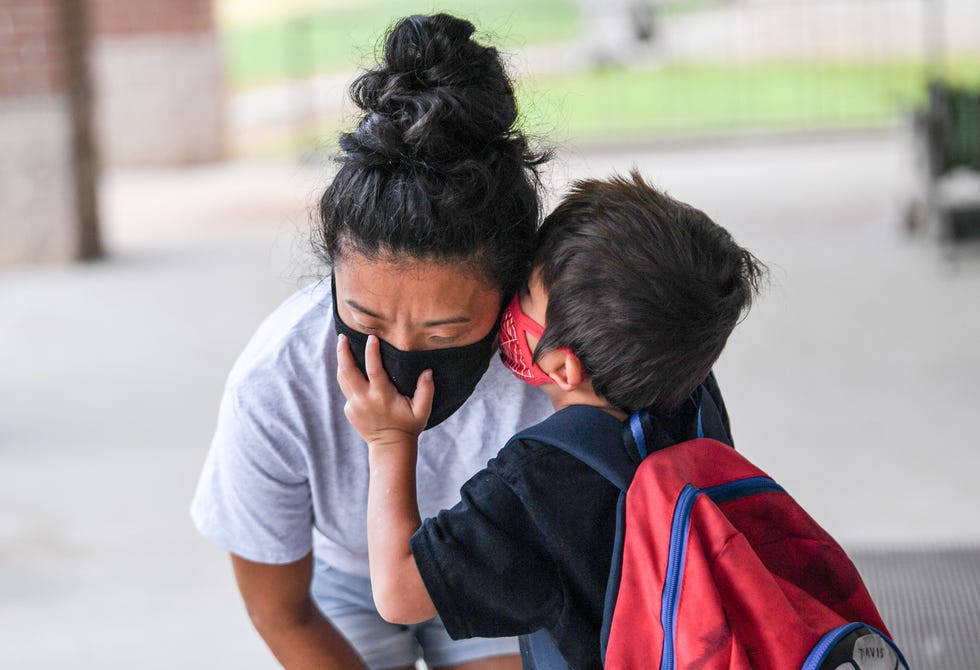 Joanna Walling, right, listens to her son Davis, 5, minutes before the first day of school in the Pickens County School District, Tuesday, August 2, 2021. 