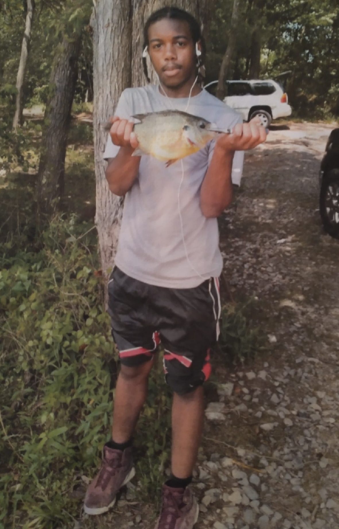 Lamaurie Gathings, 17, pictured during a 2020 fishing trip with his father, was shot and killed on June 4, 2021.