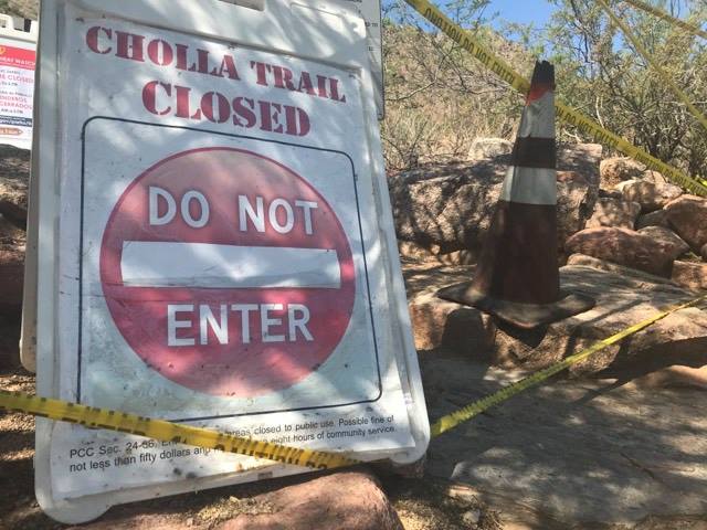 Signs at the closed Cholla trailhead on Camelback Mountain on Tuesday, Aug. 3, 2021.