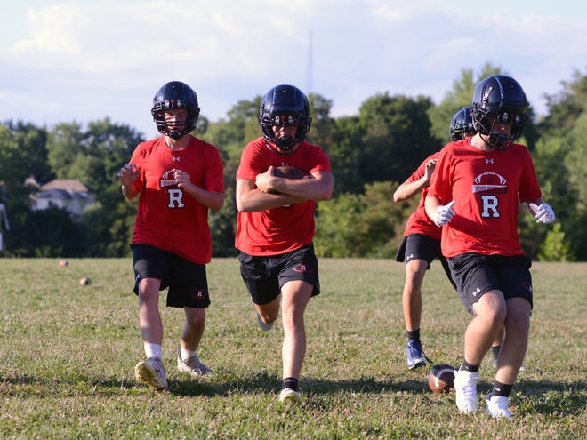 Senior Rex Hankinson runs with the ball during Rosecrans practice. Area high schools began preseason football practices on Monday.