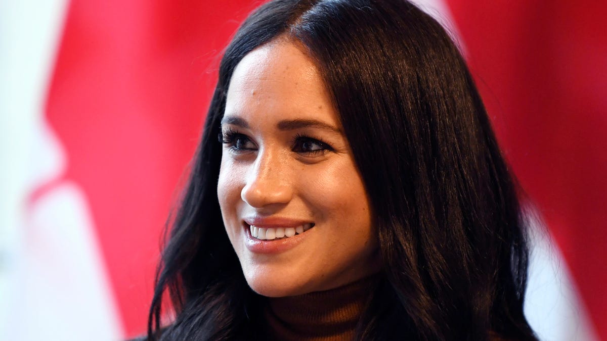 Duchess Meghan smiles during her visit with Prince Harry to Canada House, in London on Jan. 7, 2020.