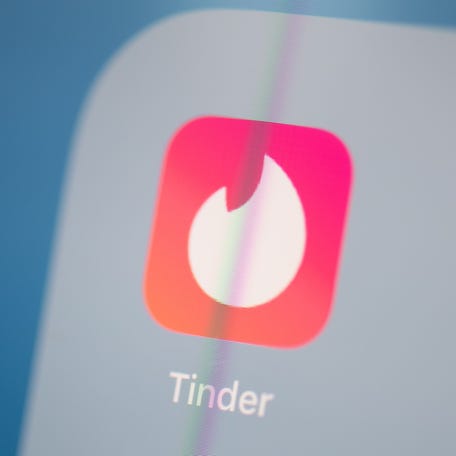 This file photo taken on July 24, 2019, shows the logo of dating app Tinder on a tablet screen.