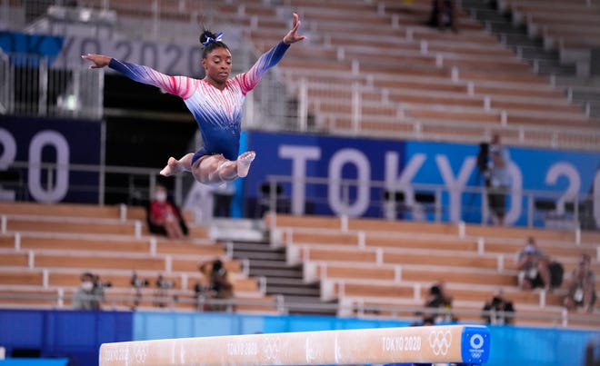 Simone Biles competes on the balance beam.