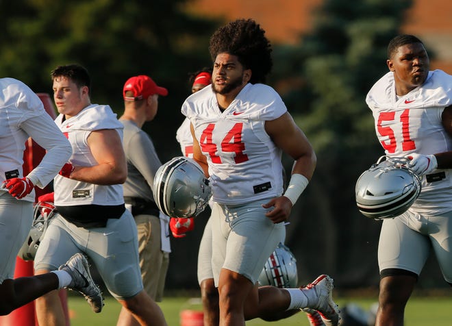Ohio State head coach Ryan Day has been very impressed "with the tremendous attention to detail" of defensive end J.T. Tuimoloau during fall camp.