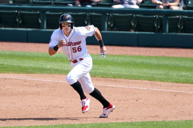 Rochester's Derek Dietrich heads for second base on a ground ball against Syracuse. 