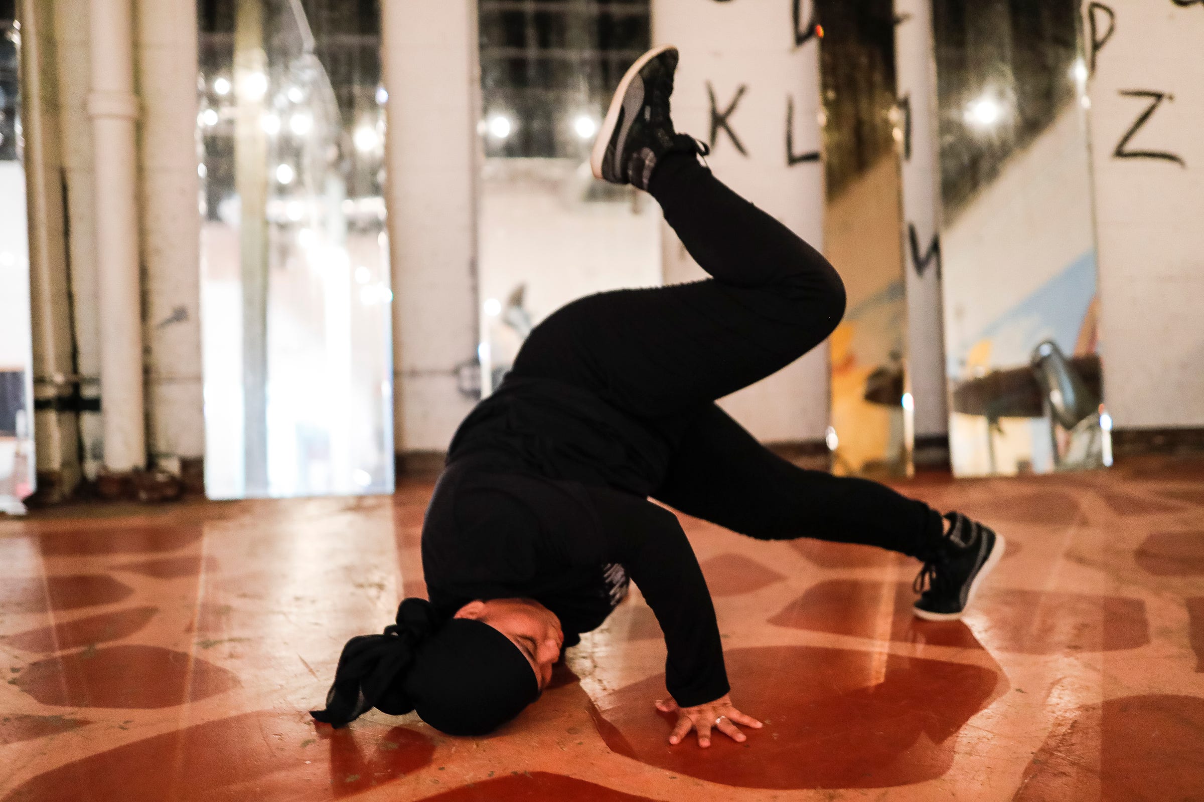 Mary Mar, also knowns as the BGIRL MAMA, practices break dance at Cass Corridor Neighborhood Development Corporation in Detroit on August 4, 2021.