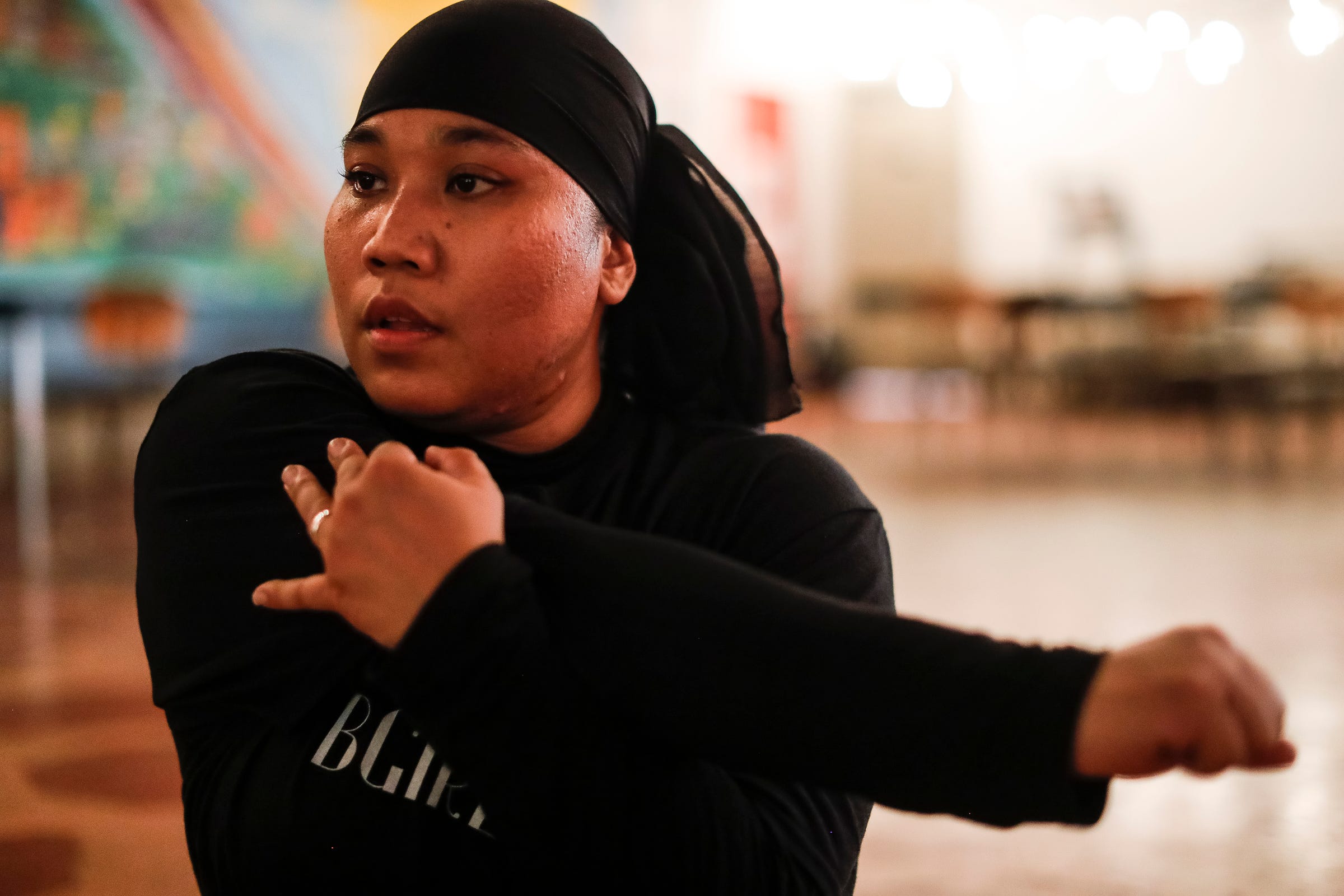 Mary Mar, also known as the BGIRL MAMA, practices break dance at Cass Corridor Neighborhood Development Corporation in Detroit on August 4, 2021.