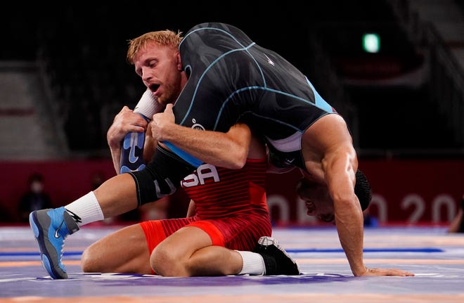 Aug 5, 2021; Chiba, Japan; Kyle Dake (USA) competes against Mostafa Hosseinkhani (IRI) in the men's freestyle 74kg 1/8 final during the Tokyo 2020 Olympic Summer Games at Makuhari Messe Hall A. Mandatory Credit: