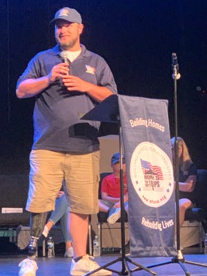U.S. Marines Lance Cpl. Bobby McCardle addressing a gathering in his honor as part of the July 24 kickoff celebration for the house that Homes for Our Troops is building for him. McCardle was severely injured by an improvised explosive device in Iraq in 2007, costing him his right leg.