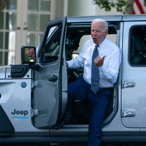 President Joe Biden gets out of a Jeep Wrangler Ru