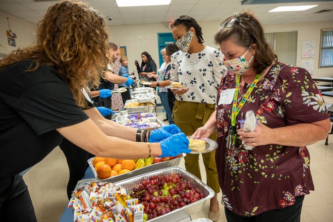 A hot breakfast is served to the teachers at Beverly Shores Elementary in Leesburg, thanks to voluntters from the Beverly Shores Partnership. [Cindy Peterson/Correspondent]