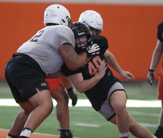Massillon defensive lineman Landen Petaros tries to get past a block by Marcus Moore during a one-on-one drill in a recent practice.
