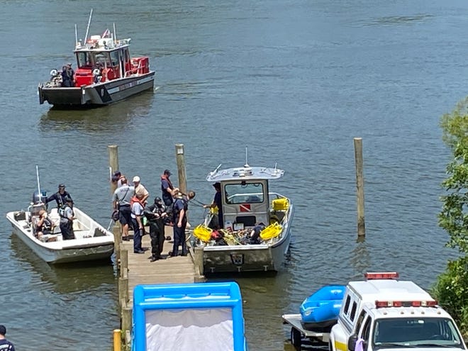 Dive crews from the Virginia Department of Wildlife Resources dock at the Dutch Gap boat landing in Chester Friday, Aug. 6, 2021. They are searching for the body of a man who fell into the James River while fishing with a friend earlier in the day.