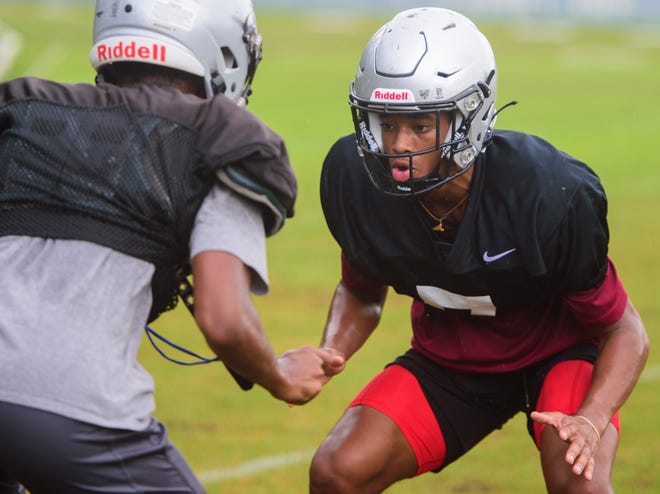 Bartram Trail High School’s Sharif Denson practices with a teammate at the school on Wednesday, Aug. 4, 2021.