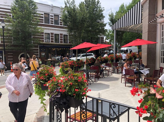 Downtown Asheville was bustling with tourists, diners and locals on Friday, Aug. 6, 2021.