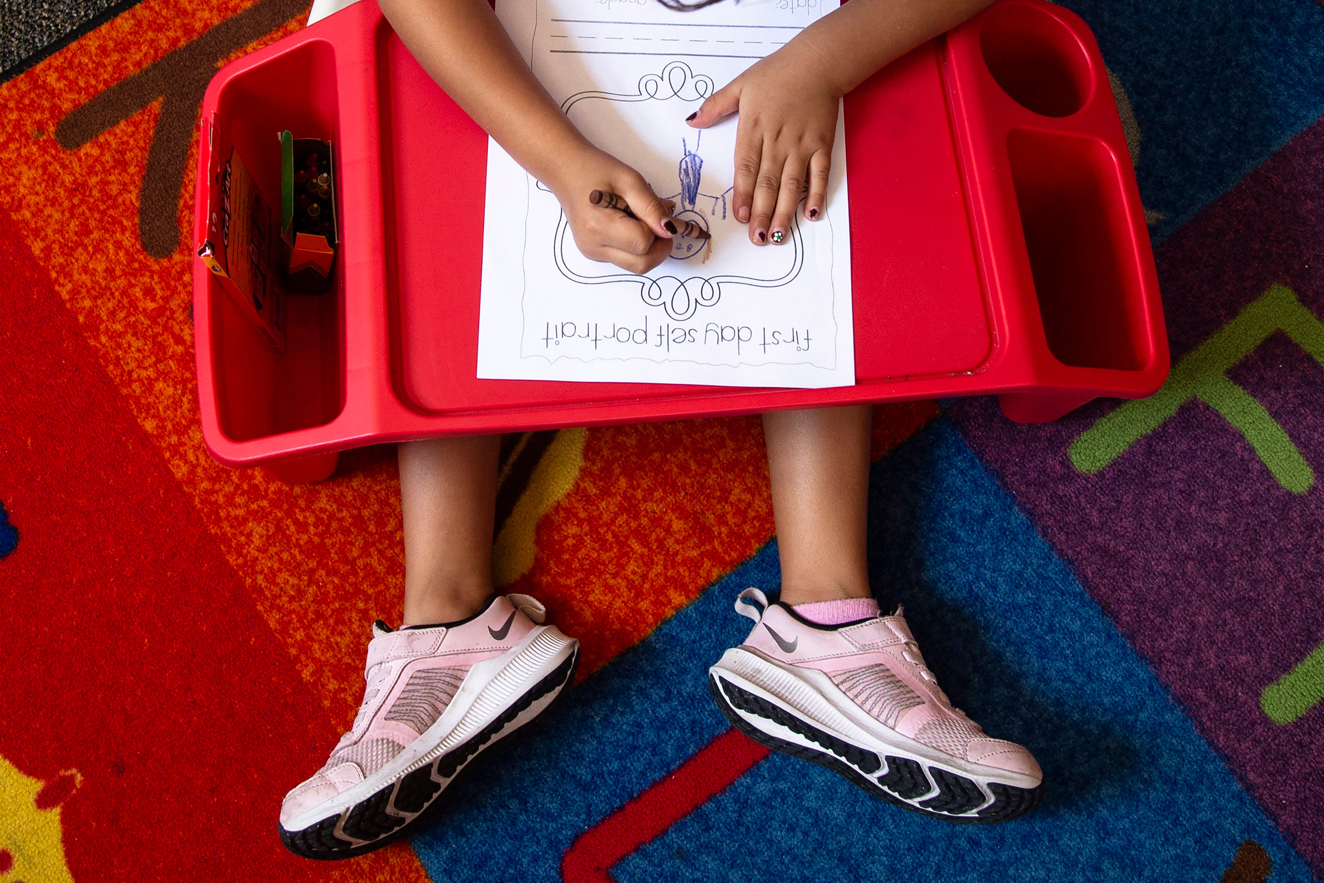 Rubi Cardozo paints a self-portrait on her first-ever day in a classroom at Freedom Elementary School in Buckeye on Aug. 4, 2021.