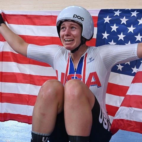Jennifer Valente poses with the U.S. flag after wi