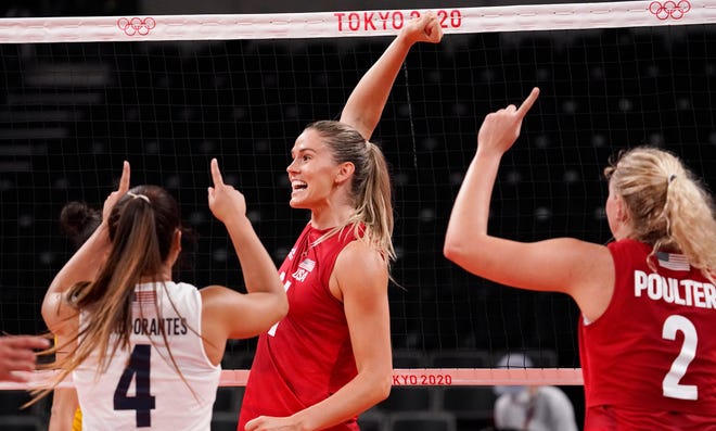 USA players Alex Obert (4), Jesse Smith (11) and Jordyn Poulter (2) react after winning a point in the women's volleyball gold medal match.