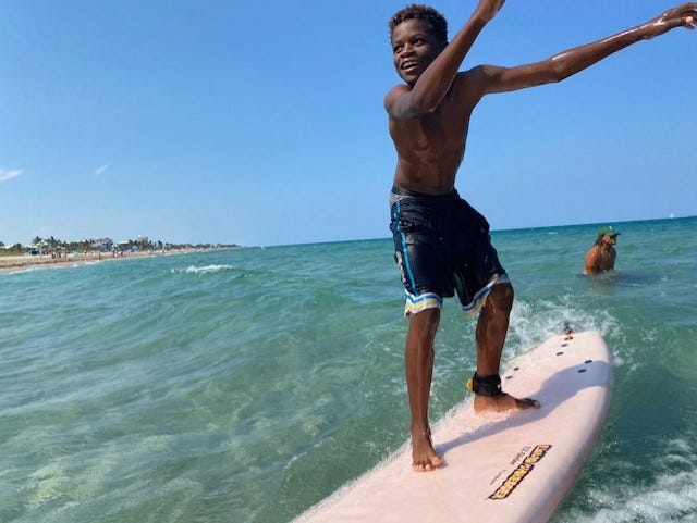 Tyrell Gammage, 11,  of Delray Beach, caught waves with other young surfers this year in the StreetWaves after school program and the Endless Summer Surf Camp.