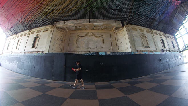 Part of The Wooden Walls Project in Asbury Park, Eric Reiger (known as hoTTea) created an art installation in the city's Casino Building that consists of yarn spaced 6 inches apart to represent Covid-19's social distancing.