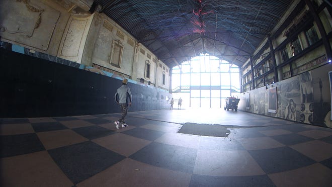 Part of The Wooden Walls Project in Asbury Park, Eric Rieger (A.K.A. HoTTea) created an art installation in the city's Casino Building - that consists of yarn spaced six inches apart to represent COVID-19's social distancing.