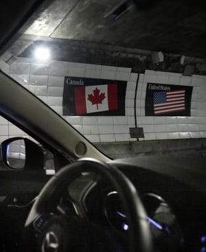 The Canada-United States of America border in the Windsor Tunnel.