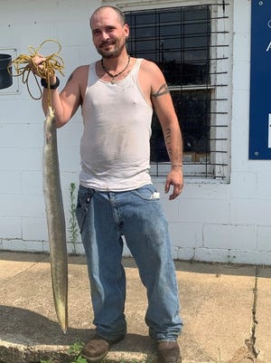 Carlin Allison, of Doniphan, holds a rare state record for American eel after reeling in a 6-pound, 15-ounce fish on the Current River. MDC confirmed this is the ninth state record fish recorded in 2021.