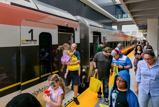 Brightline passengers exit the train in West Palm Beach from Miami, May 19, 2018, on the first day of service for the West Palm Beach to  Miami, Florida.