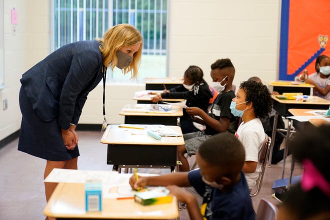 Henry County schools superintendent Mary Elizabeth Davis talks to students at Tussahaw Elementary school on Wednesday, Aug. 4, 2021, in McDonough, Ga. (AP Photo/Brynn Anderson)
