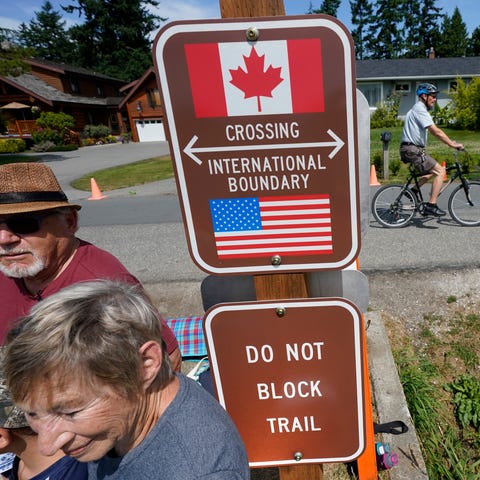 A family visits across the U.S.-Canada border at t