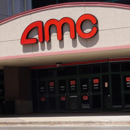 A sign hangs outside of an AMC theater on June 01, 2021 in Skokie, Illinois.