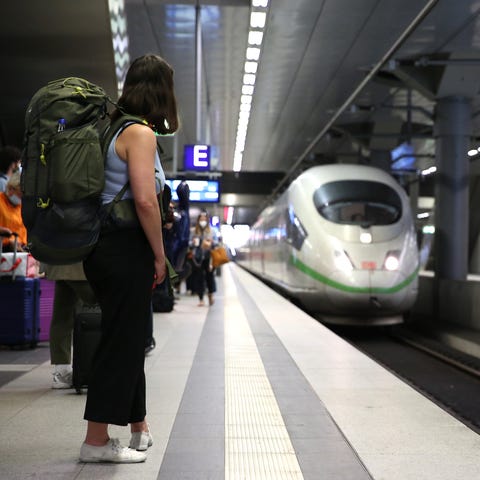A passenger looks on as an Intercity Express (ICE)