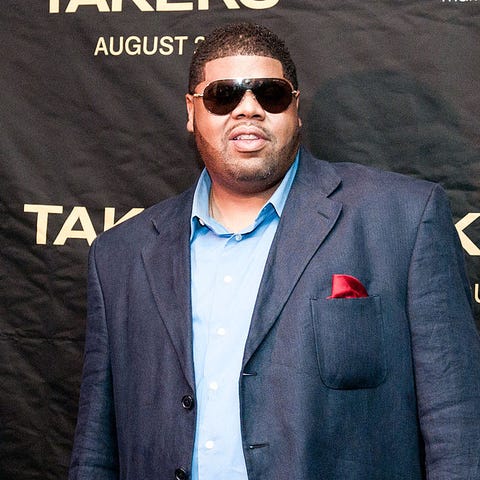 Chucky Thompson poses for photographers during a s