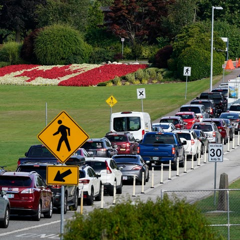 A line of vehicles wait to enter Canada at the Pea