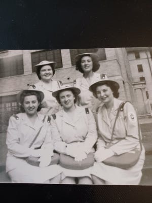 Evelyn Trovinger, top right, poses with friends who served with her in the US Cadet Nursing Corps. The organization helps meet the demand for nurses during World War II. Without knowing where they would be sent, the five friends bought friendship rings and had their initials engraved on them. They kept the rings for life. From the left in the first row are Sybil Kunkel, Ruth Ann Davison and Annabelle Stave. With Trovinger behind her is Geraldine Steinberger.