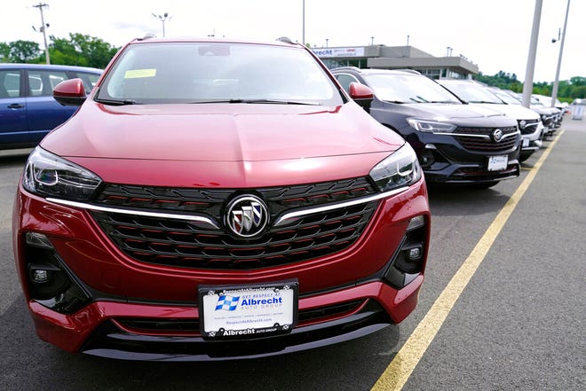New Buick Encore SUV's displayed on the sales lot at the Albrecht Auto Group dealership, Tuesday, Aug. 3, 2021, in Wakefield, Mass.