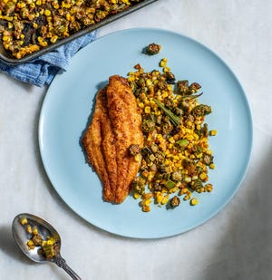 The recipes in "Kevin Belton's Cookin' Louisiana" include Louisiana catfish with okra and corn. (Courtesy of Gibbs Smith)