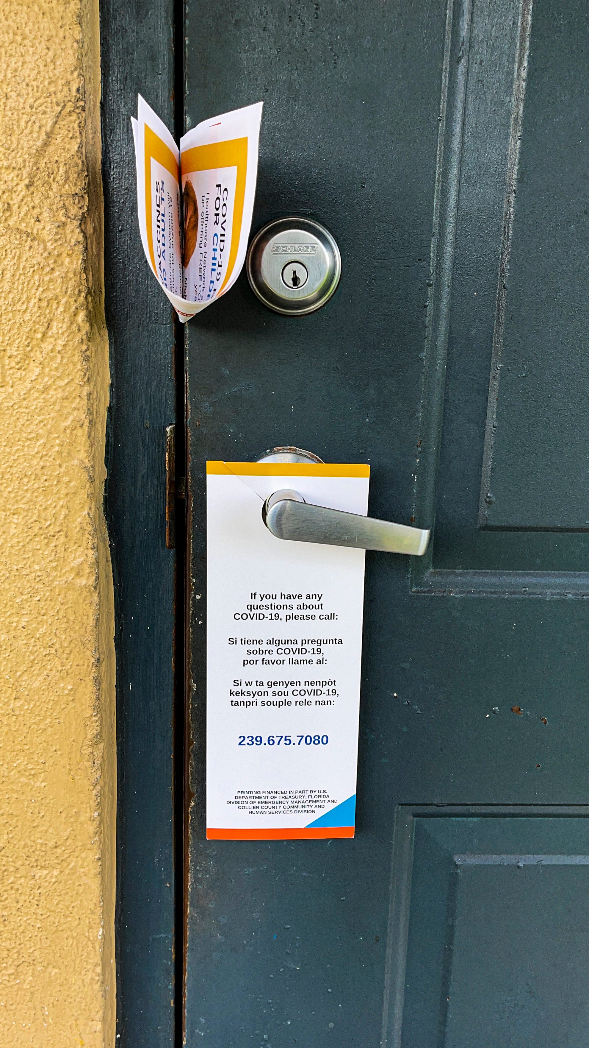 The Healthcare Network's COVID-19 response team leave fliers on testing and vaccines in various languages if people don't answer their doors when they go door-to-door offering information.