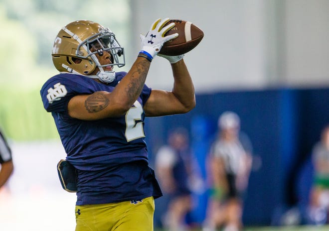 Converted Notre Dame wide receiver Xavier Watts has been taking coaching from injured safety Kyle Hamilton this week in practice.