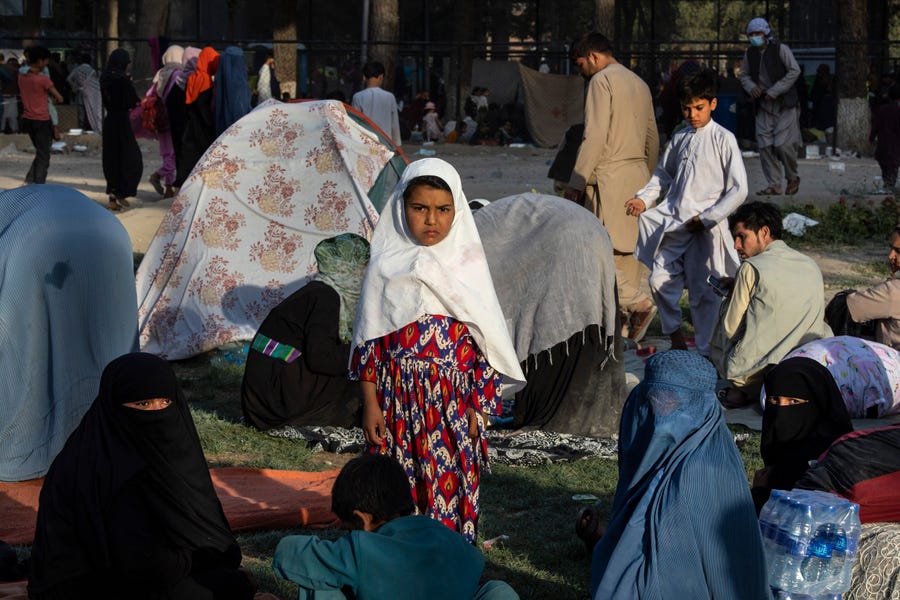 Displaced Afghans are seen at a makeshift IDP camp in Share-e-Naw park to various mosques and schools on August 12, 2021 in Kabul, Afghanistan. People displaced by the Taliban advancing are flooding into the Kabul capital to escape the Taliban takeover of their provinces.
