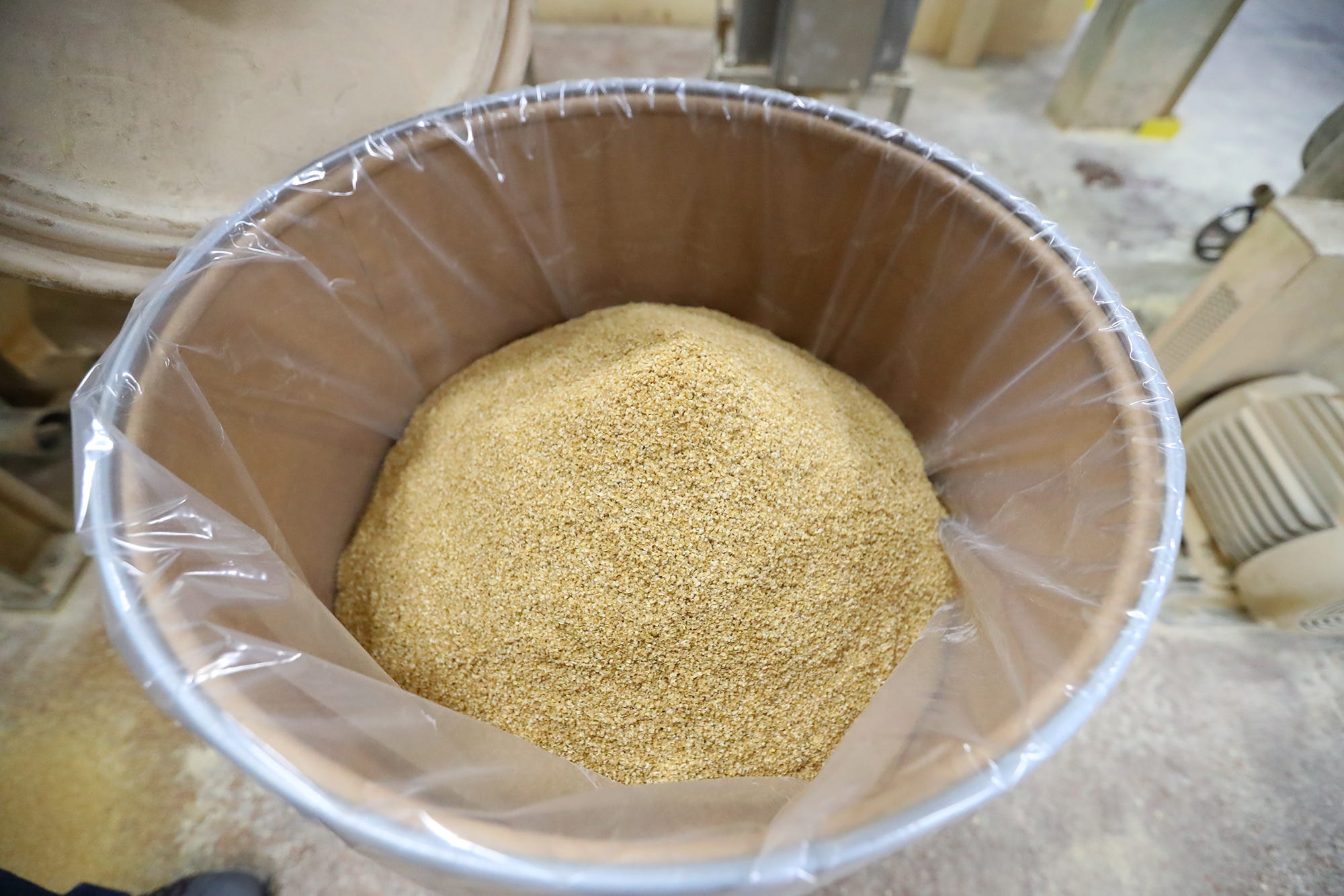 A barrel filled with 125 pounds of mustard bran at Wisconsin Spice is part of the 75 million pounds of mustard products made each year at the Berlin factory.
