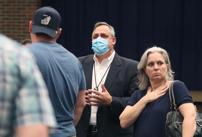 John Lanave, Clarkstown Schools Assistant Supervisor of Business, asks unmasked attendees to leave during a Clarkstown School Board meeting at Clarkstown South in West Nyack Aug. 12, 2021.