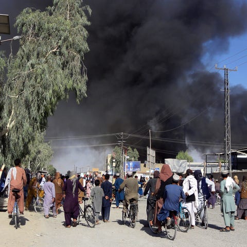 Smoke rises after fighting between the Taliban and