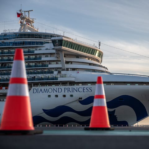 Diamond Princess cruise ship sits docked at Daikok