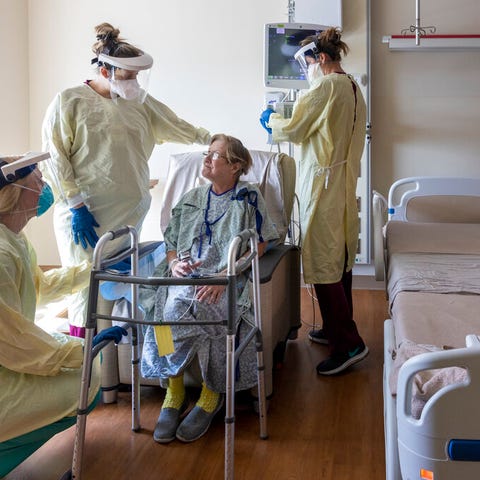 Dr. Kristen Rogers, left, works with occupational 