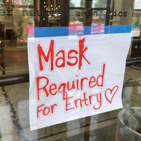Businesses large and small are reinstituting mask 