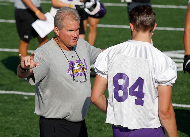 Ashland University's coach Scott Valentine talks with a player during the first football practice of the season at Jack Miller Stadium on Saturday, Aug. 14, 2021. Valentine was named the new Madison football coach on Wednesday.