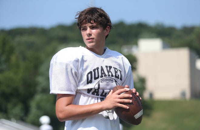 Quaker Valley quarterback Connery Bulger looks down field for an open receiver during training camp Friday afternoon at Quaker Valley High School. 